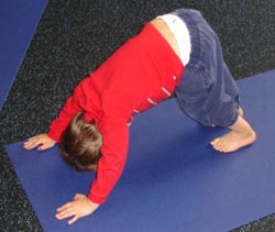 child doing yoga stretches